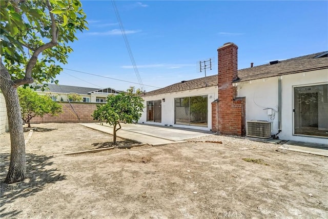 10422 Gilbert St, Anaheim, CA 92804 - back of property with a patio area, a chimney, and stucco siding