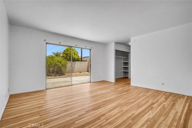 10422 Gilbert St, Anaheim, CA 92804 - unfurnished room featuring wood finished floors and baseboards