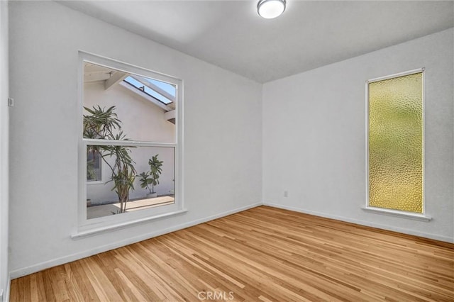 10422 Gilbert St, Anaheim, CA 92804 - empty room with wood finished floors and baseboards