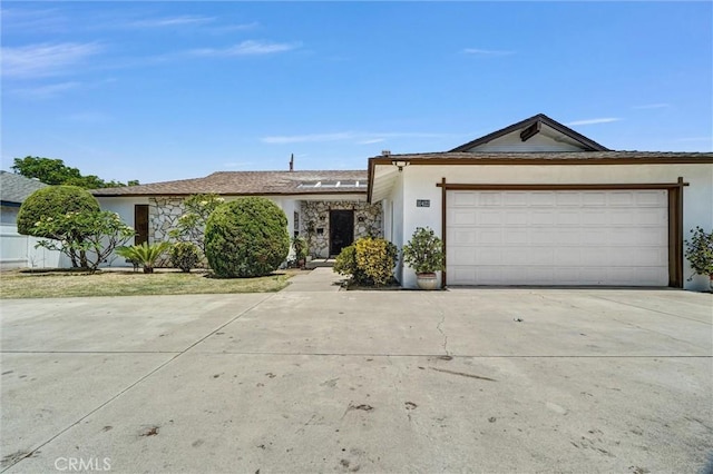10422 Gilbert St, Anaheim, CA 92804 - single story home with stucco siding, driveway, an attached garage, and stone siding