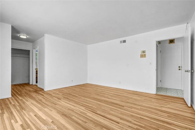 10422 Gilbert St, Anaheim, CA 92804 - unfurnished living room featuring light wood-style floors and baseboards