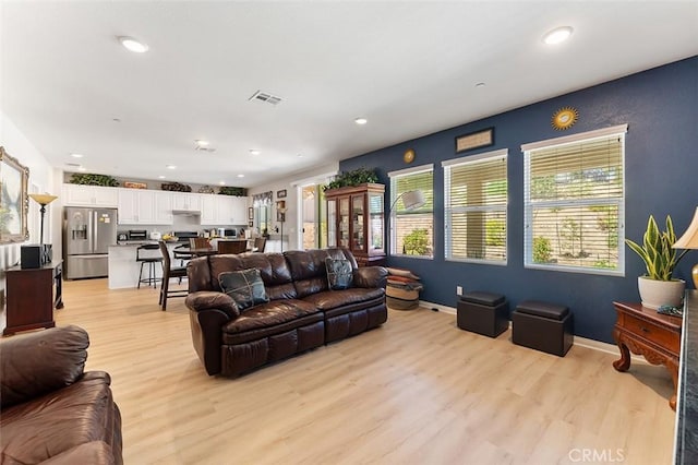 4073 Tamarind Rdg, Lake Elsinore, CA 92530 - living room with light wood-style flooring and recessed lighting