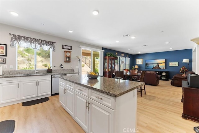 4073 Tamarind Rdg, Lake Elsinore, CA 92530 - kitchen with stainless steel dishwasher, light wood-style floors, plenty of natural light, and recessed lighting