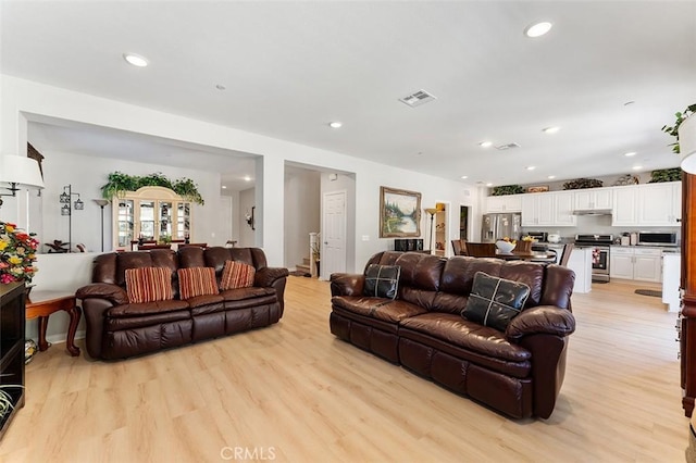 4073 Tamarind Rdg, Lake Elsinore, CA 92530 - living room featuring light wood-style flooring and recessed lighting