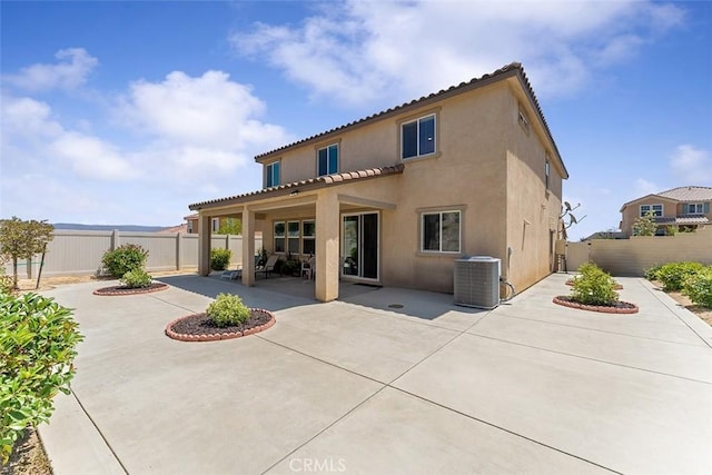 4073 Tamarind Rdg, Lake Elsinore, CA 92530 - back of house with a patio, a fenced backyard, and stucco siding