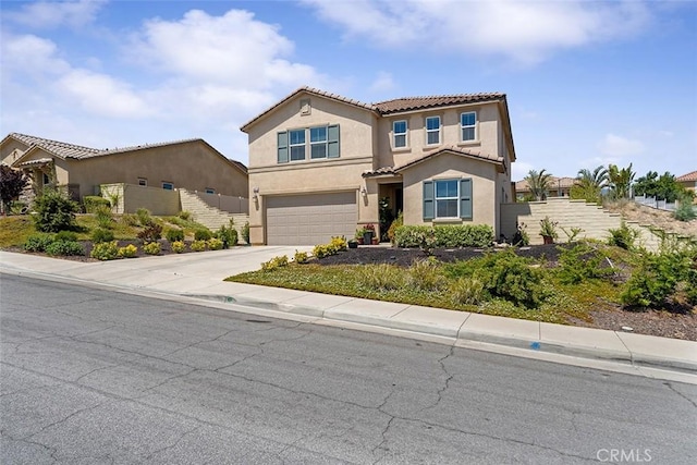 4073 Tamarind Rdg, Lake Elsinore, CA 92530 - view of front of home with a tile roof, a garage, stucco siding, and concrete driveway