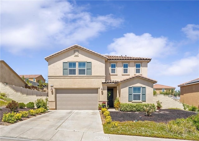 4073 Tamarind Rdg, Lake Elsinore, CA 92530 - mediterranean / spanish home with stucco siding, an attached garage, concrete driveway, and a tiled roof
