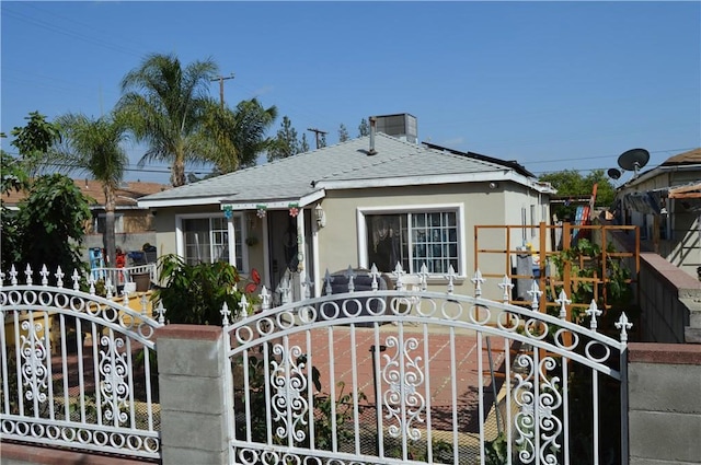 13104 Hoyt St, Pacoima, CA 91331 - view of front of home featuring a gate, roof with shingles, and a fenced front yard