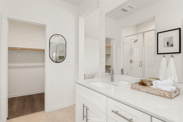 542 Cultivate, Irvine, CA 92618 - full bath with a spacious closet, a shower stall, vanity, and tile patterned floors