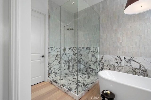 1115 Myles Ln, Nipomo, CA 93444 - full bathroom featuring a soaking tub, a shower stall, and wood finished floors