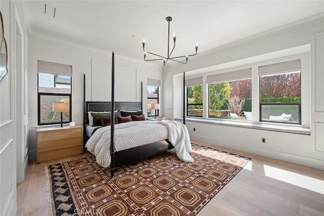 1115 Myles Ln, Nipomo, CA 93444 - bedroom with a chandelier, multiple windows, light wood-style flooring, and ornamental molding