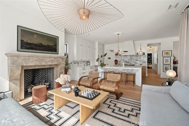 1115 Myles Ln, Nipomo, CA 93444 - living area with light wood-type flooring and a fireplace