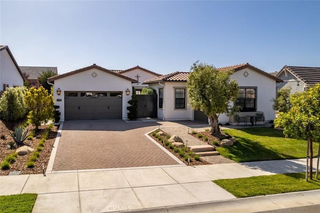 1115 Myles Ln, Nipomo, CA 93444 - mediterranean / spanish-style home with decorative driveway, stucco siding, an attached garage, a front yard, and a tiled roof