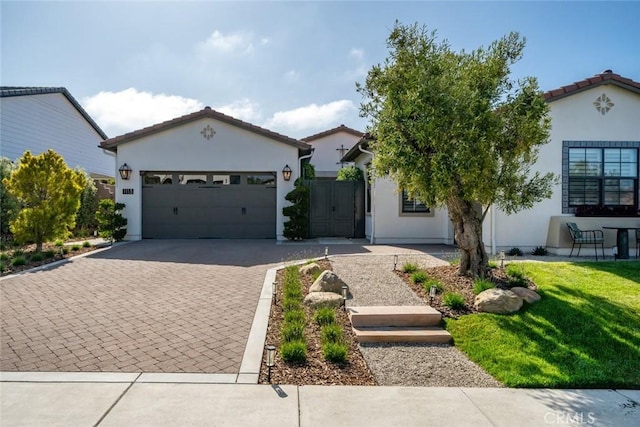 1115 Myles Ln, Nipomo, CA 93444 - view of front of home with stucco siding, a garage, decorative driveway, and a front yard