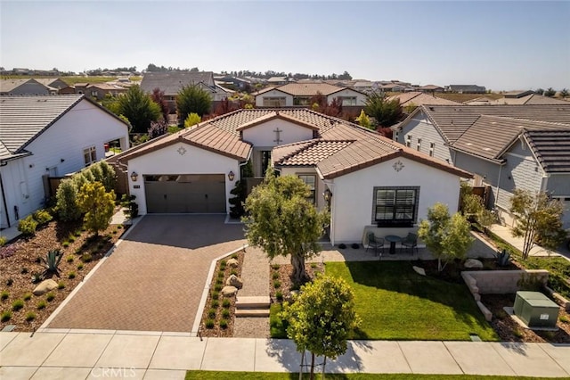 1115 Myles Ln, Nipomo, CA 93444 - mediterranean / spanish house featuring a residential view, decorative driveway, a garage, and stucco siding