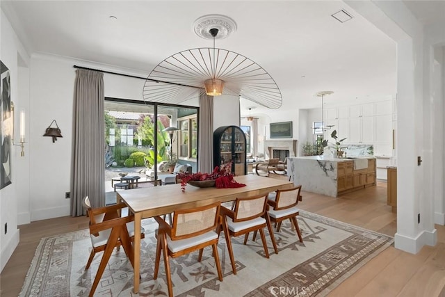 1115 Myles Ln, Nipomo, CA 93444 - dining area featuring light wood-style floors and a fireplace