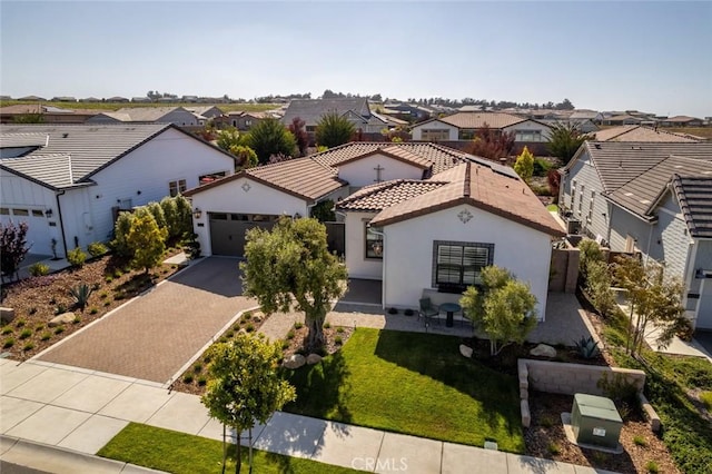 1115 Myles Ln, Nipomo, CA 93444 - mediterranean / spanish house featuring a residential view, driveway, a garage, stucco siding, and a front lawn