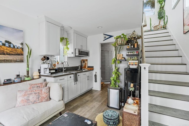 1009 S Cleveland St, Oceanside, CA 92054 - living area with stairway and light wood-style floors