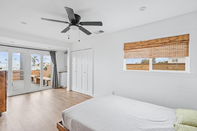 1009 S Cleveland St, Oceanside, CA 92054 - bedroom featuring access to exterior, wood finished floors, a ceiling fan, french doors, and a closet