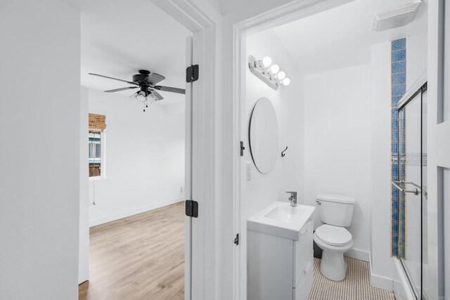 1009 S Cleveland St, Oceanside, CA 92054 - full bath featuring vanity, ceiling fan, an enclosed shower, and wood finished floors