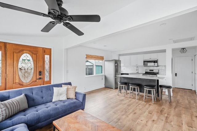 1009 S Cleveland St, Oceanside, CA 92054 - living area with light wood finished floors and a ceiling fan