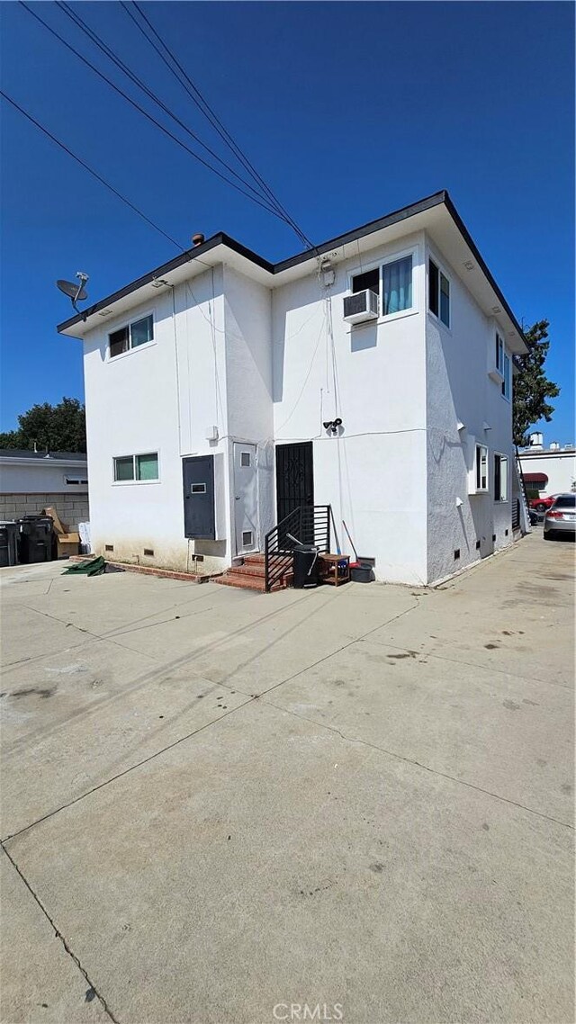 3029 Pacific Ave, Long Beach, CA 90806 - rear view of property featuring crawl space and stucco siding