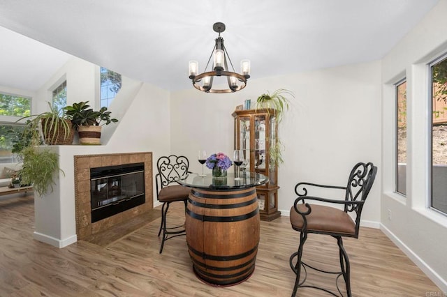 3430 Corte Viejo, Carlsbad, CA 92009 - living area with wood finished floors, a chandelier, and a tile fireplace