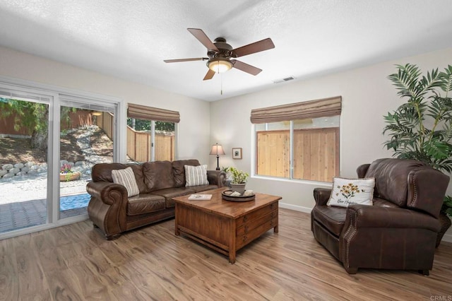 3430 Corte Viejo, Carlsbad, CA 92009 - living area with wood finished floors, healthy amount of natural light, and ceiling fan