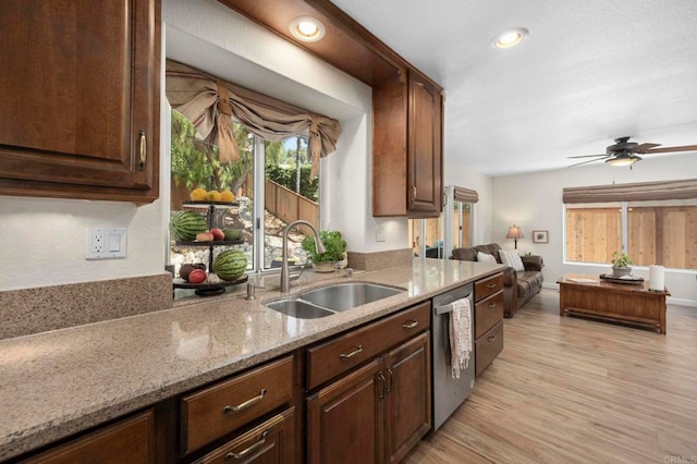 3430 Corte Viejo, Carlsbad, CA 92009 - kitchen featuring dishwasher, light stone countertops, light wood finished floors, ceiling fan, and open floor plan
