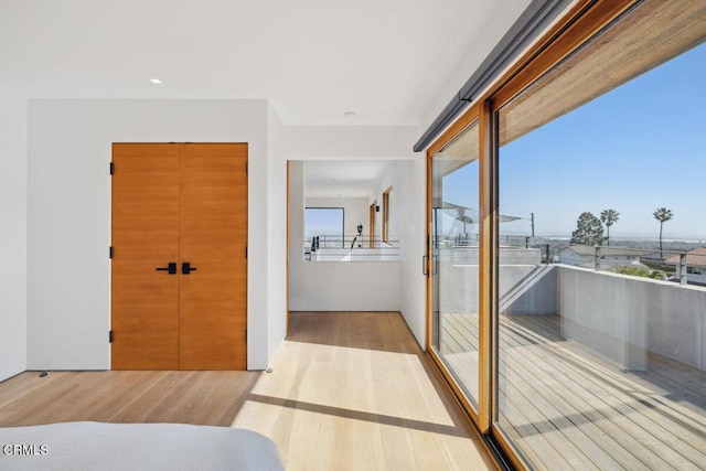 572 Skyline Rd, Ventura, CA 93003 - unfurnished bedroom with multiple windows and wood finished floors