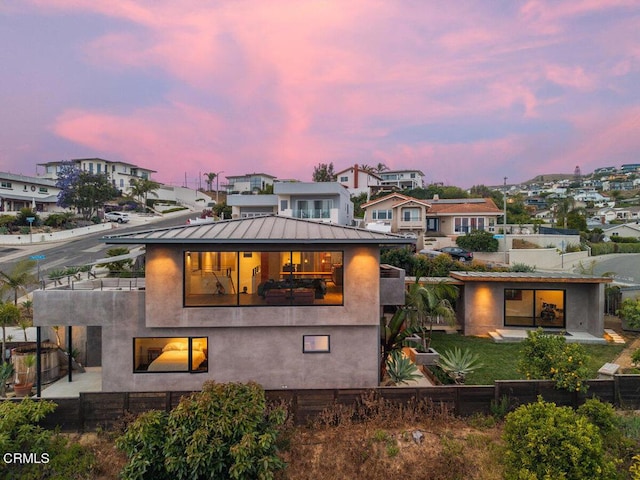 572 Skyline Rd, Ventura, CA 93003 - back of property featuring a balcony, a standing seam roof, a residential view, and stucco siding