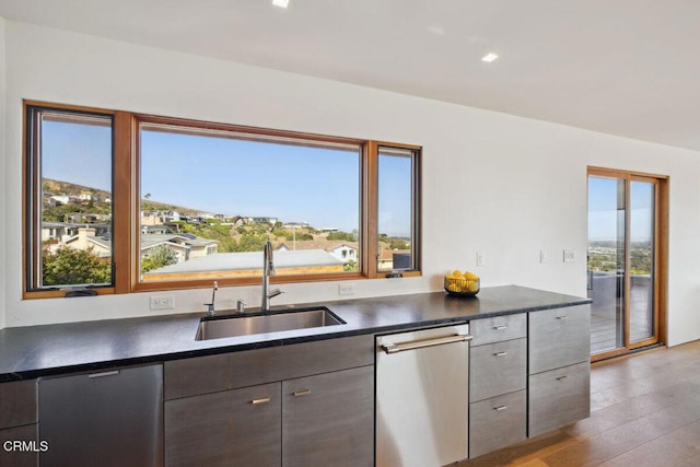 572 Skyline Rd, Ventura, CA 93003 - kitchen with dark countertops, dishwasher, wood finished floors, and recessed lighting