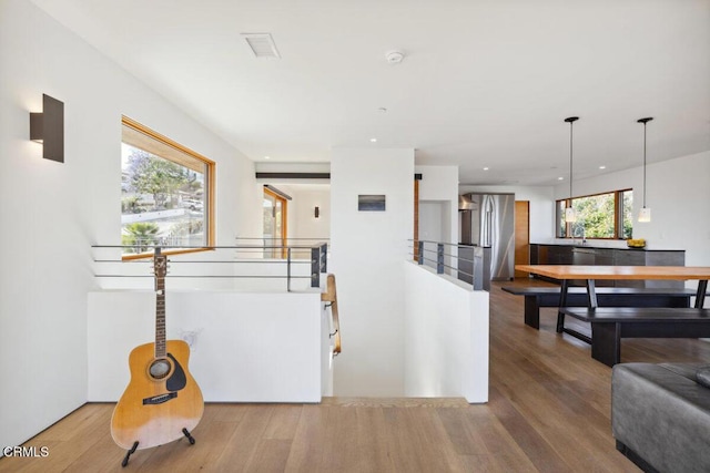 572 Skyline Rd, Ventura, CA 93003 - hall with an upstairs landing, wood finished floors, and recessed lighting