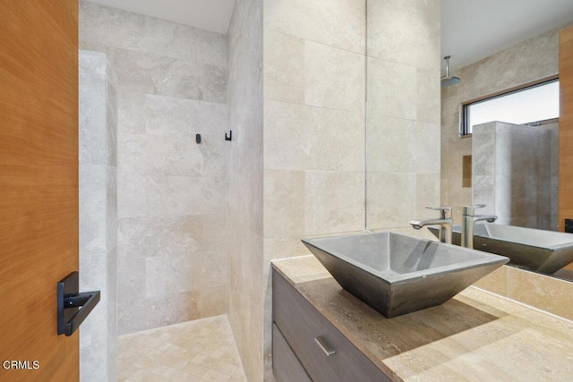 572 Skyline Rd, Ventura, CA 93003 - bathroom featuring a walk in shower, vanity, and tile walls