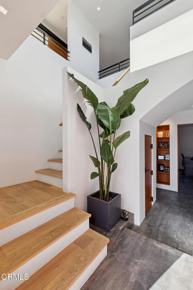 572 Skyline Rd, Ventura, CA 93003 - stairway with a high ceiling and wood finished floors