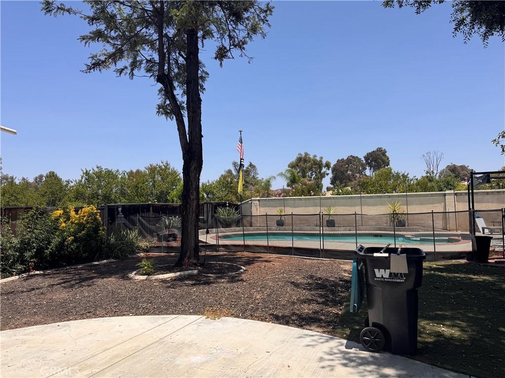 24870 Appian Way, Murrieta, CA 92562 - fenced backyard featuring a patio