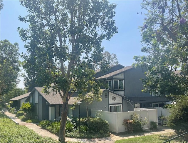 20359 Ivy Hill Ln Unit 13, Yorba Linda, CA 92886 - rear view of property with stucco siding and a shingled roof