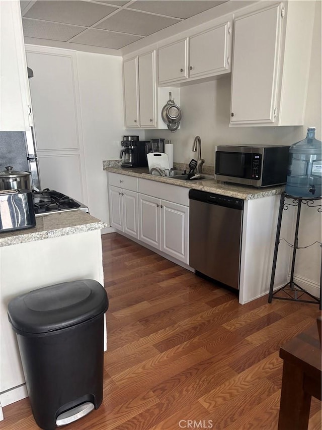 20359 Ivy Hill Ln Unit 13, Yorba Linda, CA 92886 - kitchen with stainless steel appliances, white cabinetry, and dark wood-style floors