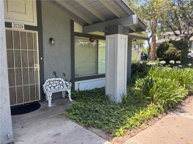 20359 Ivy Hill Ln Unit 13, Yorba Linda, CA 92886 - doorway to property featuring stucco siding and covered porch