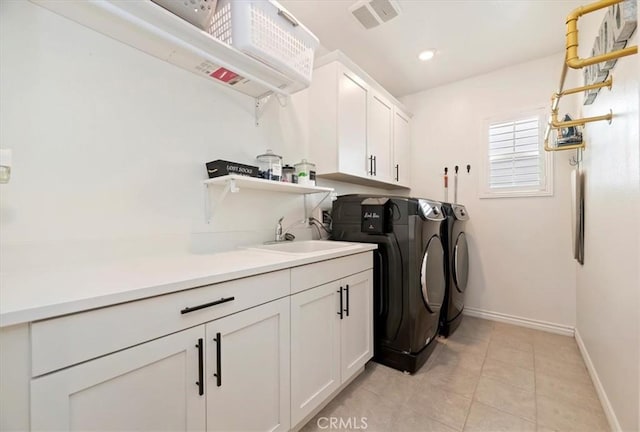 2516 Chad Zeller Ln, Corona, CA 92882 - washroom with cabinet space, washing machine and clothes dryer, and light tile patterned floors