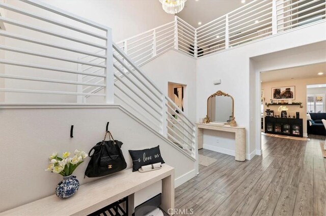 2516 Chad Zeller Ln, Corona, CA 92882 - foyer with stairs, wood finished floors, and a high ceiling