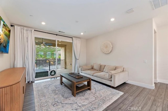2516 Chad Zeller Ln, Corona, CA 92882 - living area featuring light wood finished floors and recessed lighting