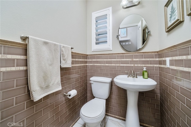 1782 Saige View Cir, Upland, CA 91784 - half bathroom with a wainscoted wall, tile walls, and healthy amount of natural light