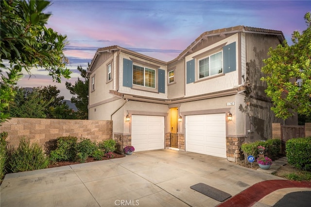 1782 Saige View Cir, Upland, CA 91784 - view of front of home featuring stone siding, a garage, concrete driveway, and stucco siding