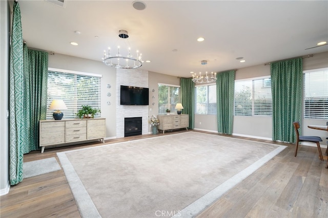 1782 Saige View Cir, Upland, CA 91784 - unfurnished living room featuring a chandelier, light wood finished floors, plenty of natural light, and recessed lighting