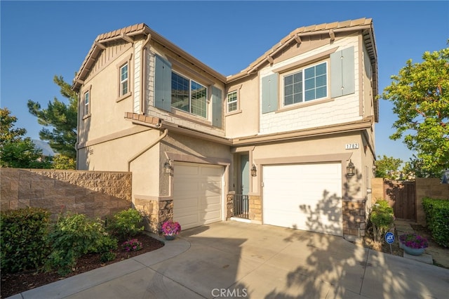 1782 Saige View Cir, Upland, CA 91784 - view of front of property with a garage, stucco siding, stone siding, and concrete driveway