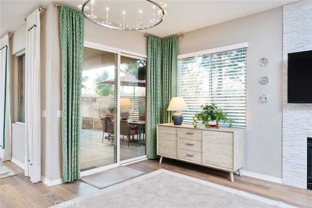 1782 Saige View Cir, Upland, CA 91784 - entryway with a chandelier, wood finished floors, and a fireplace
