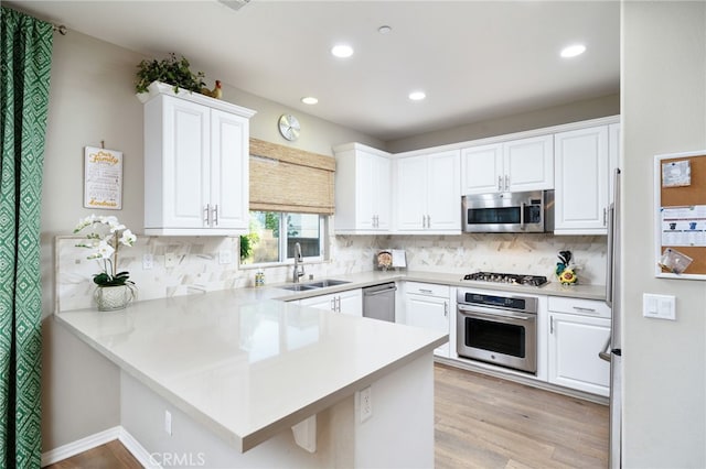 1782 Saige View Cir, Upland, CA 91784 - kitchen featuring stainless steel appliances, a peninsula, recessed lighting, and white cabinets