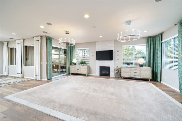 1782 Saige View Cir, Upland, CA 91784 - unfurnished living room featuring a chandelier, wood finished floors, plenty of natural light, and recessed lighting