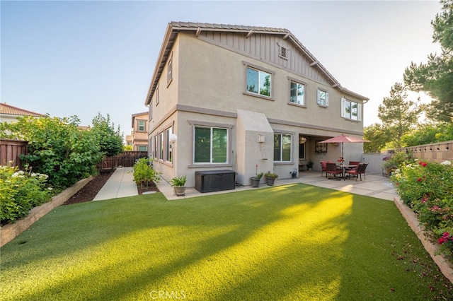 1782 Saige View Cir, Upland, CA 91784 - rear view of property featuring stucco siding, a patio area, a fenced backyard, and board and batten siding